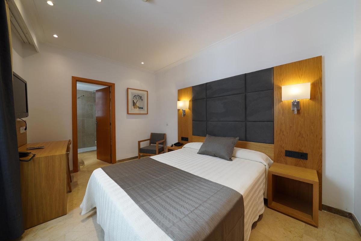 Cama o camas de una habitación en Hotel Artmadams