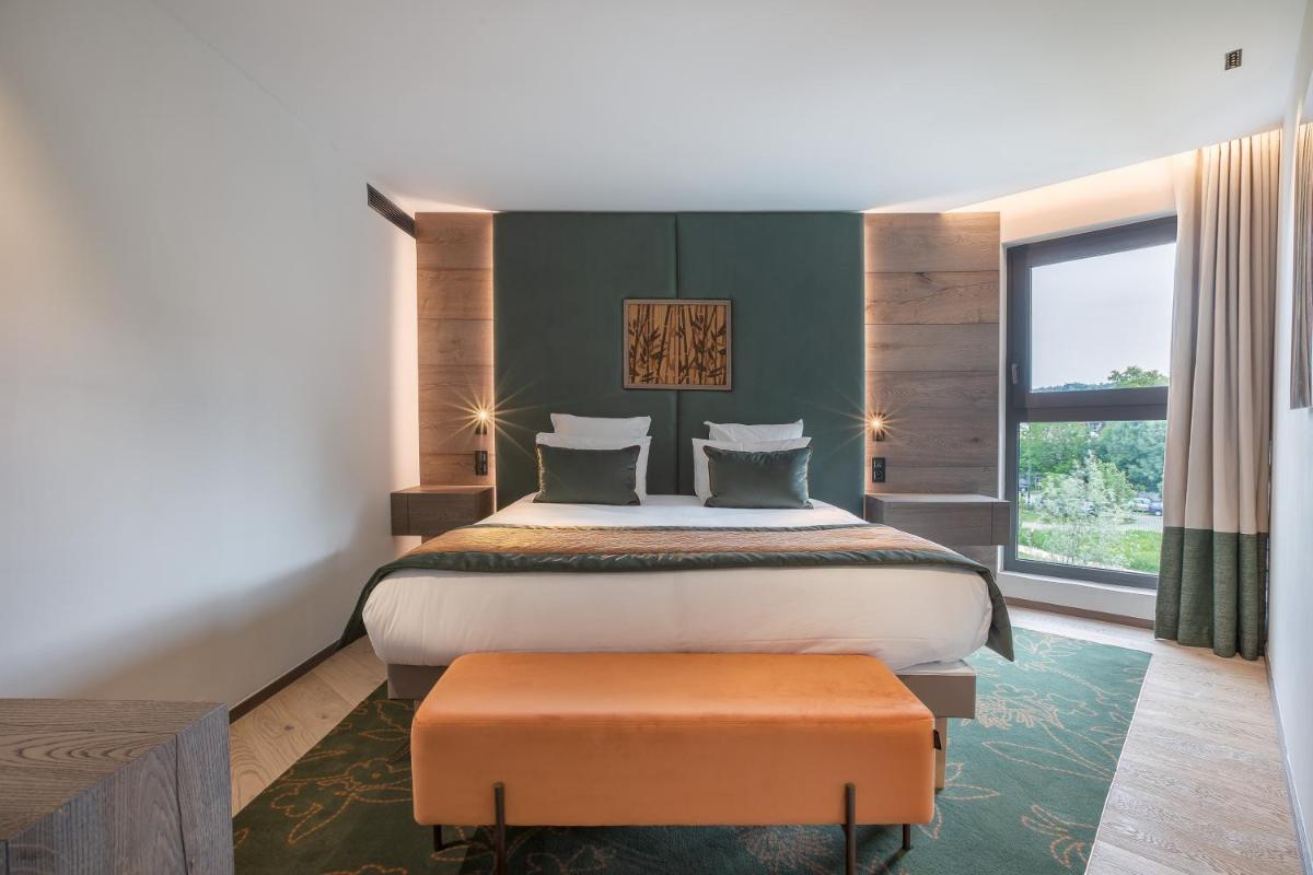 Un ou plusieurs lits dans un hébergement de l'établissement Rivage Hôtel & Spa Annecy