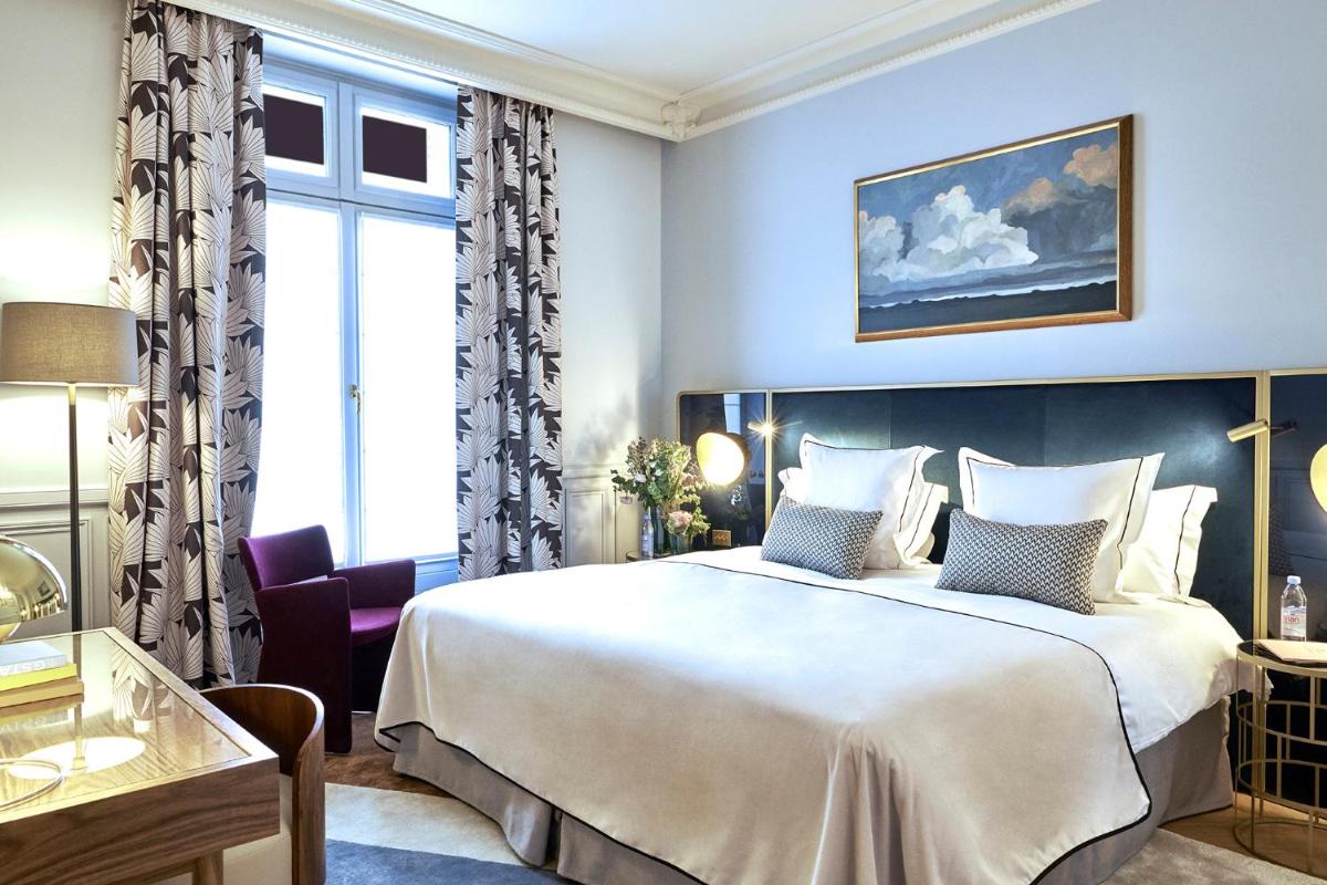Un ou plusieurs lits dans un hébergement de l'établissement Grand Powers Hotel