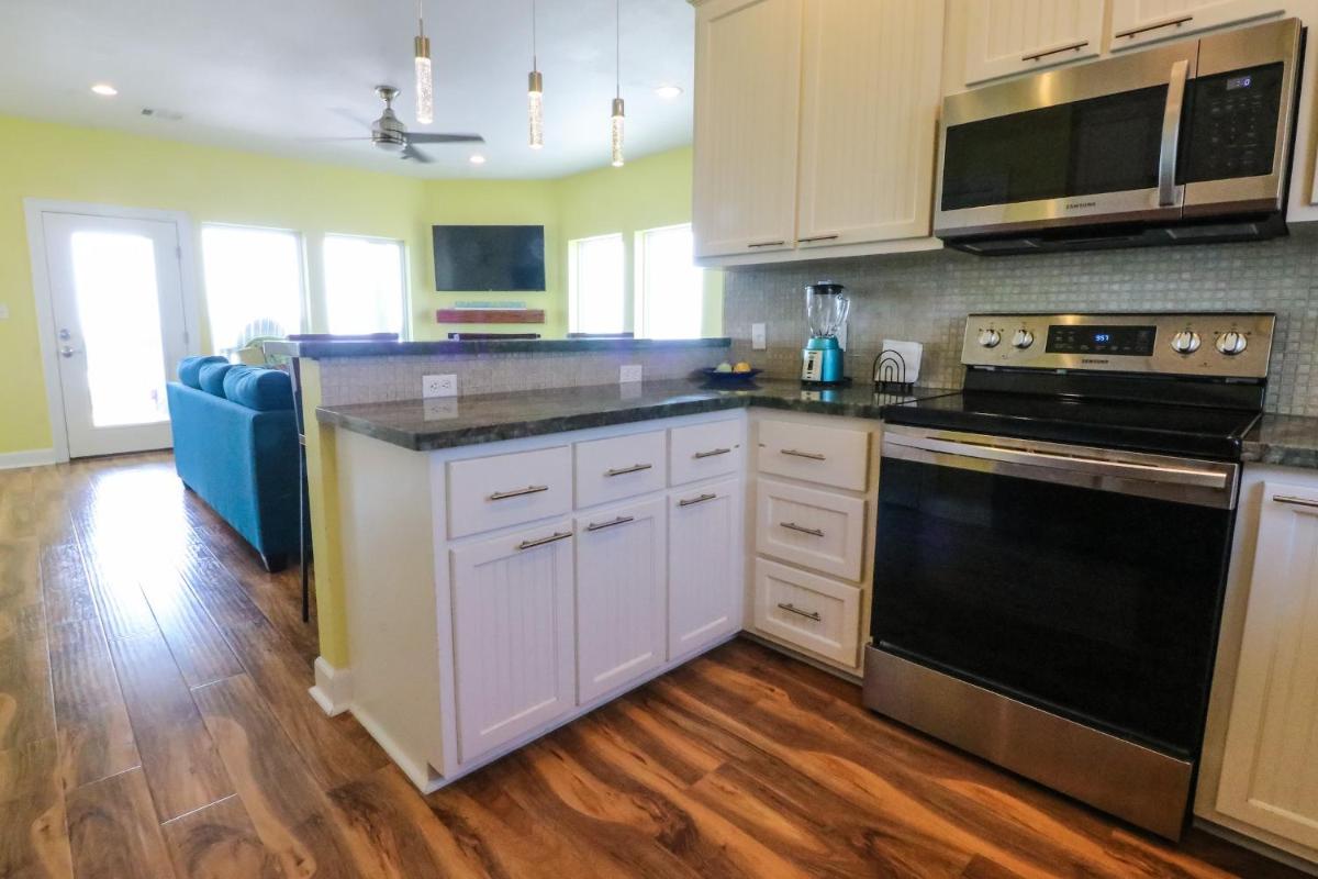 Awave From It All Treasure Island Beach Home with Breathtaking views from two decks - Housity