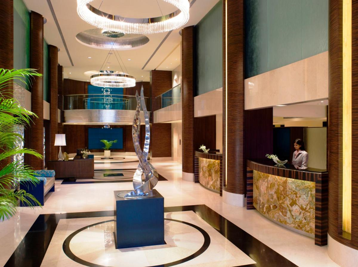 a lobby with a trophy in the middle of it at Blue Diamond Pune IHCL SeleQtions in Pune
