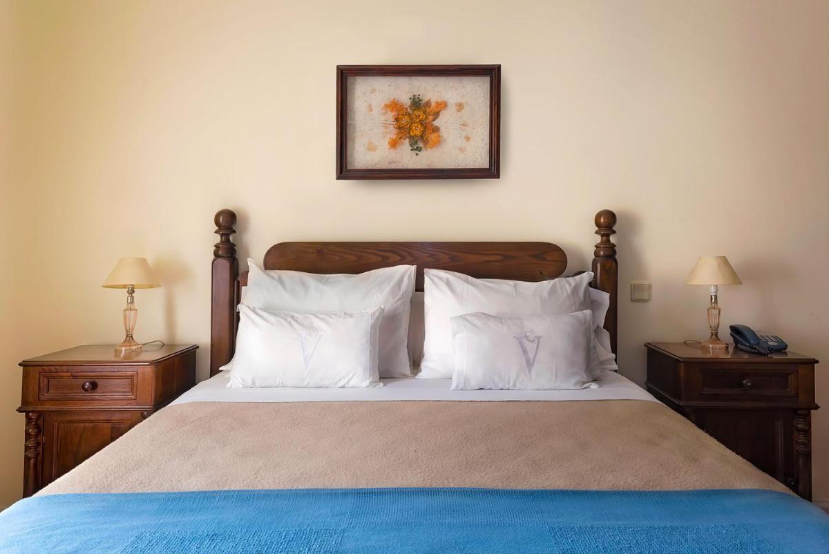 Uma cama ou camas num quarto em Estalagem do Vale