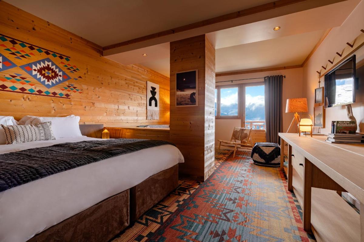 Un ou plusieurs lits dans un hébergement de l'établissement Chalet Hotel Kaya