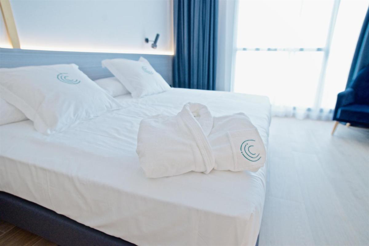 Cama o camas de una habitación en Syncrosfera Fitness & Spa Health Hotel Boutique