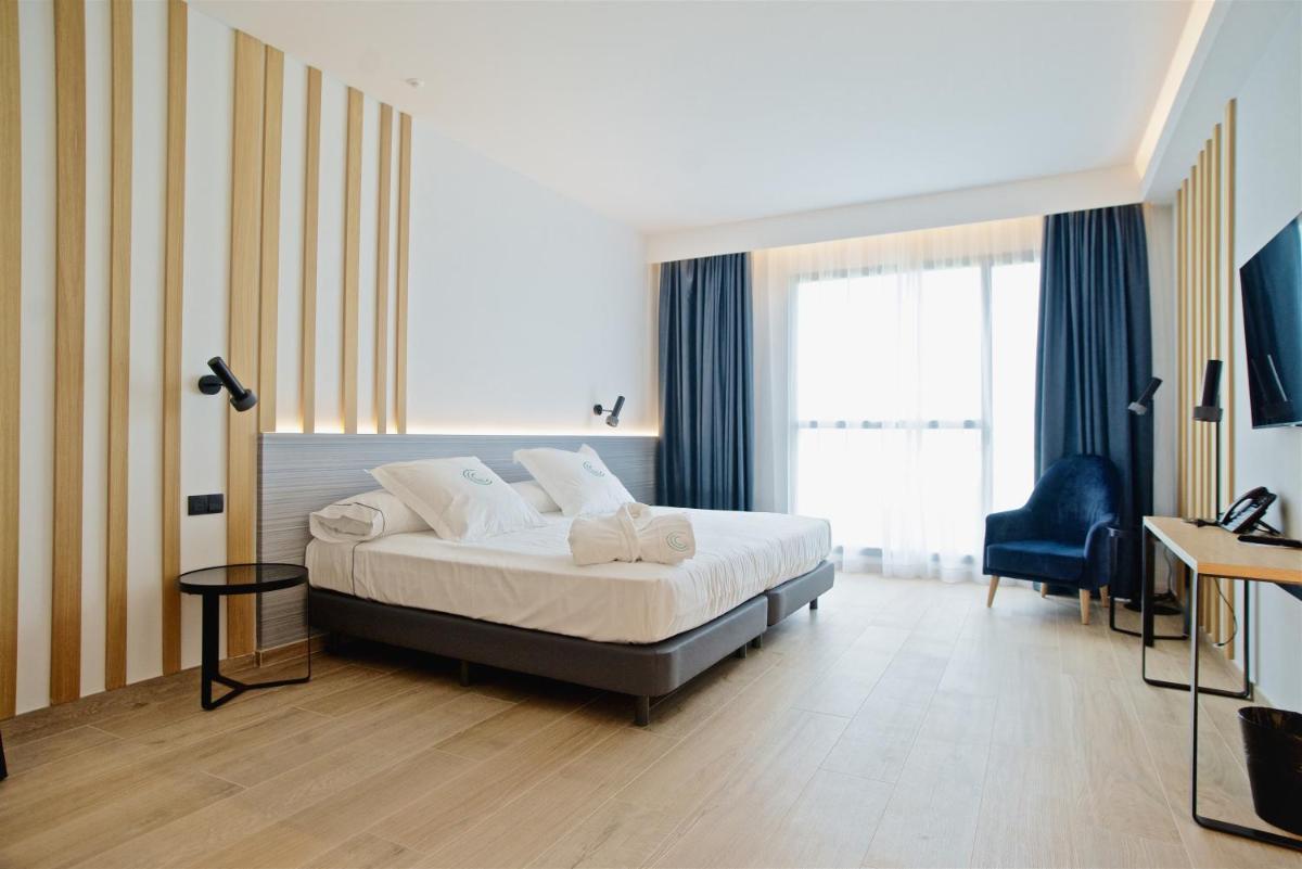 Cama o camas de una habitación en Syncrosfera Fitness & Spa Health Hotel Boutique