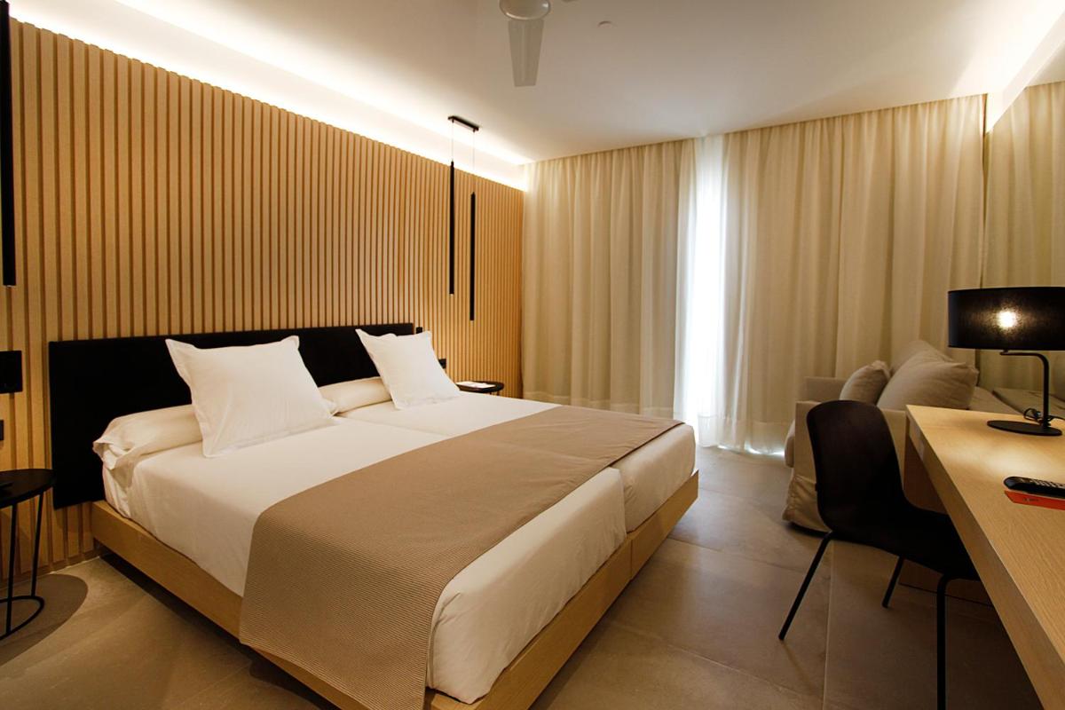 Cama o camas de una habitación en BG Caballero