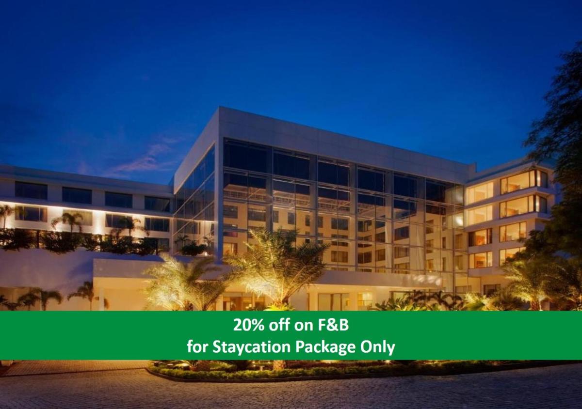 an office building with a sign that reads off on fba for vacation at Radisson Blu Plaza Hotel Hyderabad Banjara Hills in Hyderabad an office building with a sign that reads off on fba for vacation at Radisson Blu Plaza Hotel Hyderabad Banjara Hills in Hyderabad