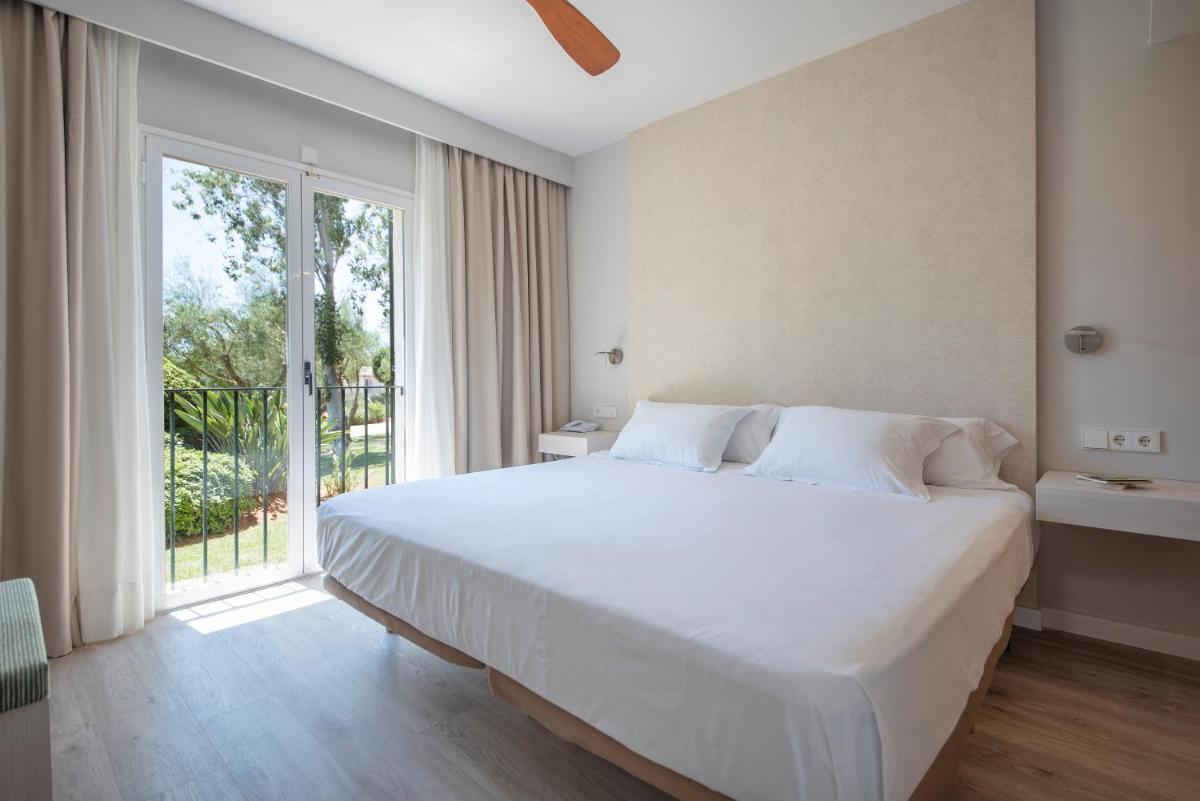Cama o camas de una habitación en Blau Colònia Sant Jordi