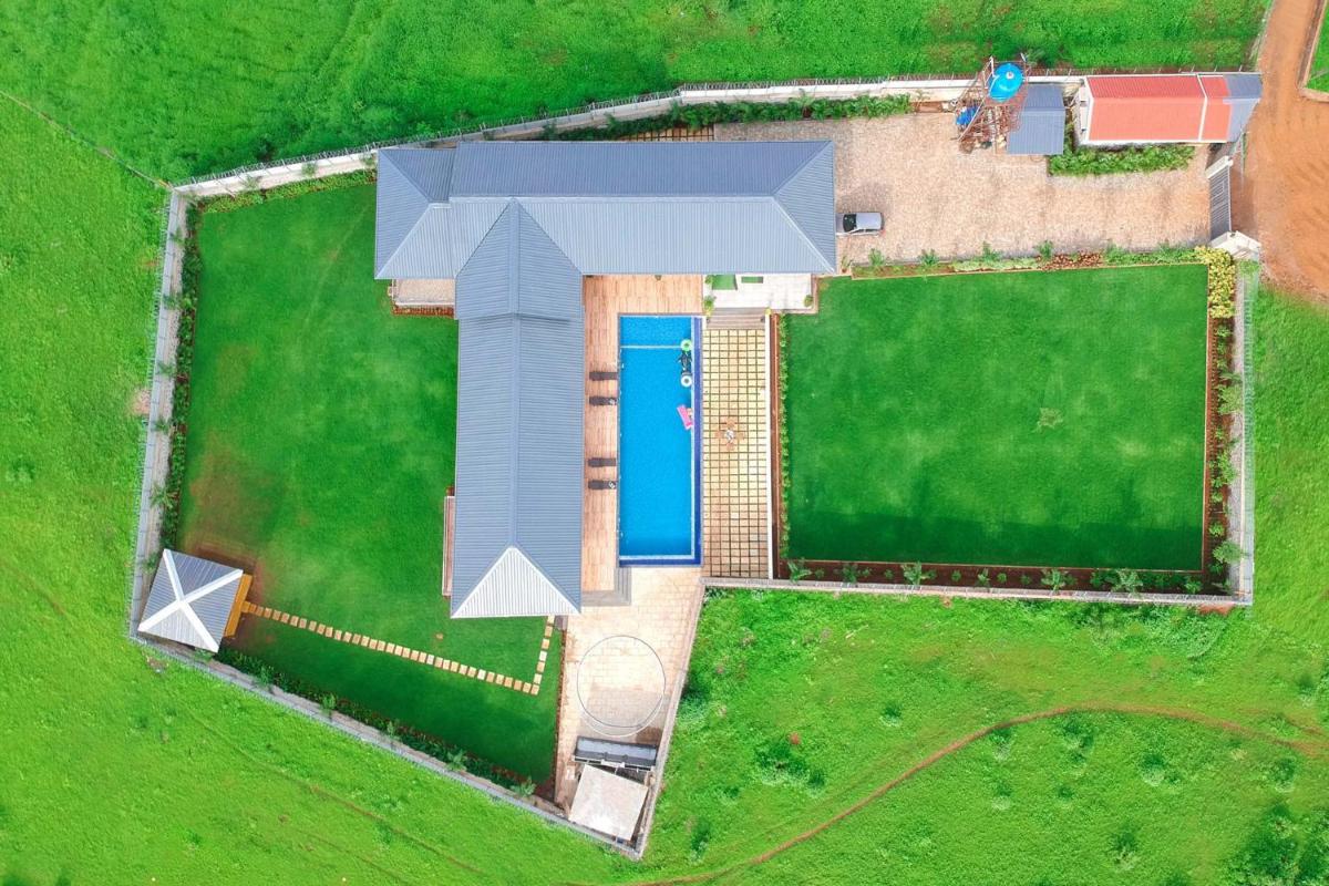 Ferias Vita by StayVista with Turf, Rainshower, Lawn, Swimming pool and Gazebo - Housity