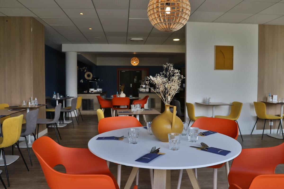 Restaurant ou autre lieu de restauration dans l'établissement SOWELL HOTELS Mont Blanc et SPA