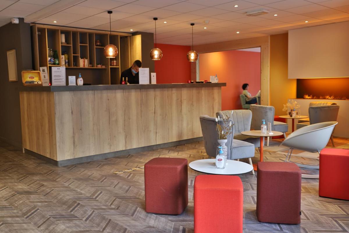 Coin salon dans l'établissement SOWELL HOTELS Mont Blanc et SPA