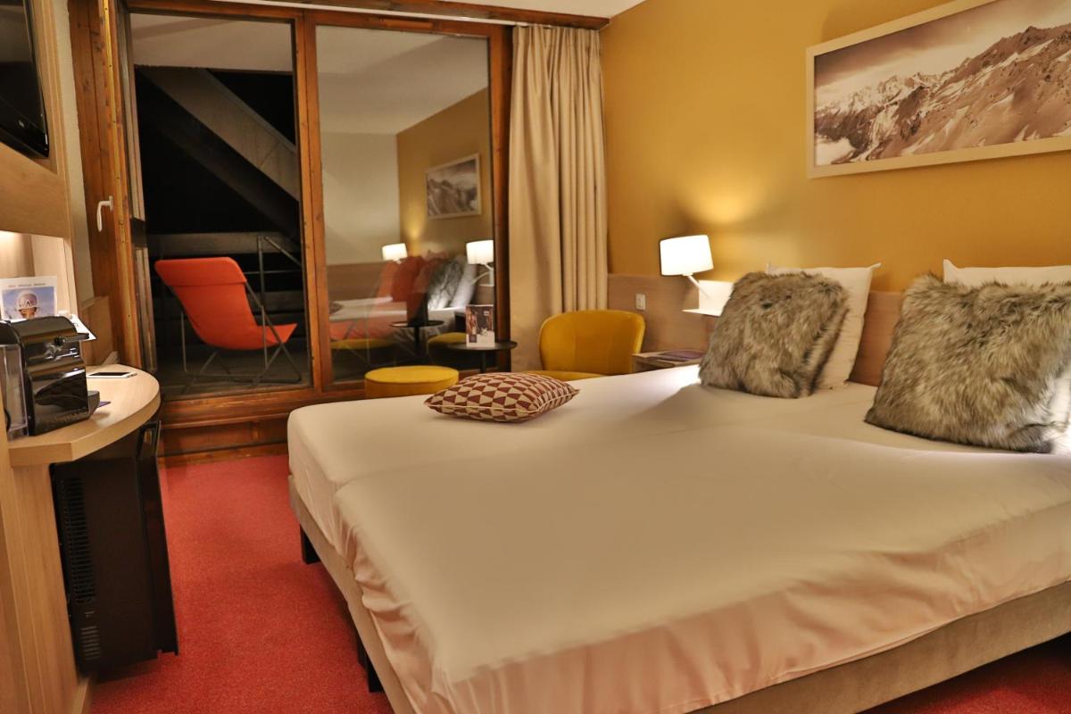 Un ou plusieurs lits dans un hébergement de l'établissement SOWELL HOTELS Mont Blanc et SPA