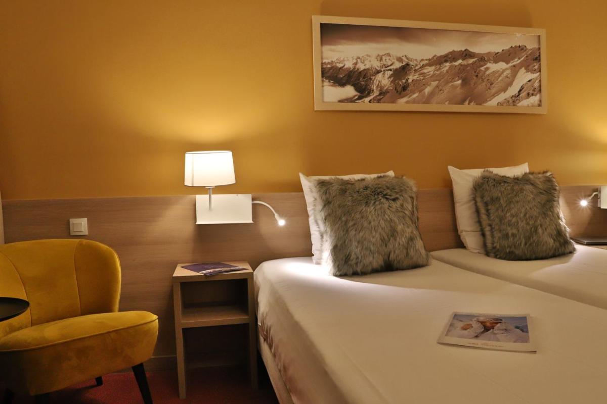 Un ou plusieurs lits dans un hébergement de l'établissement SOWELL HOTELS Mont Blanc et SPA