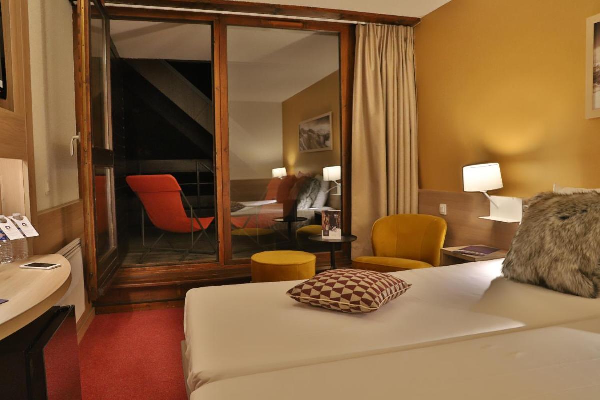 Un ou plusieurs lits dans un hébergement de l'établissement SOWELL HOTELS Mont Blanc et SPA
