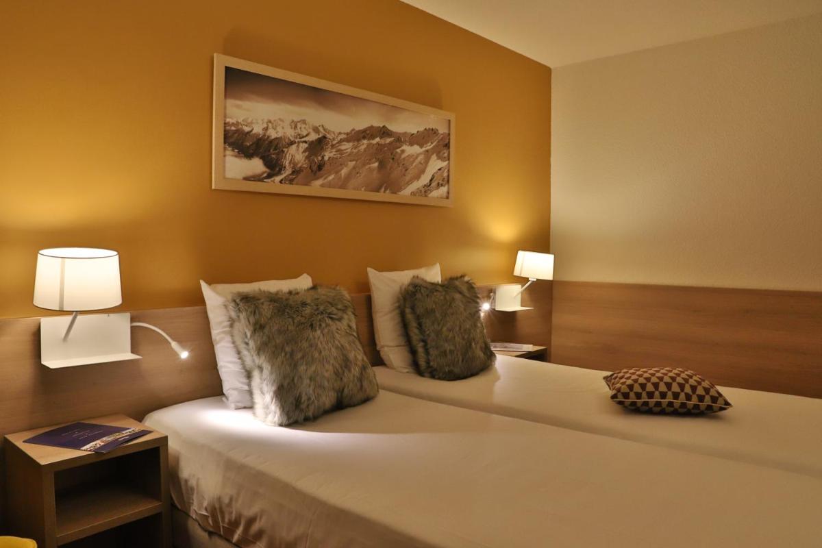Un ou plusieurs lits dans un hébergement de l'établissement SOWELL HOTELS Mont Blanc et SPA