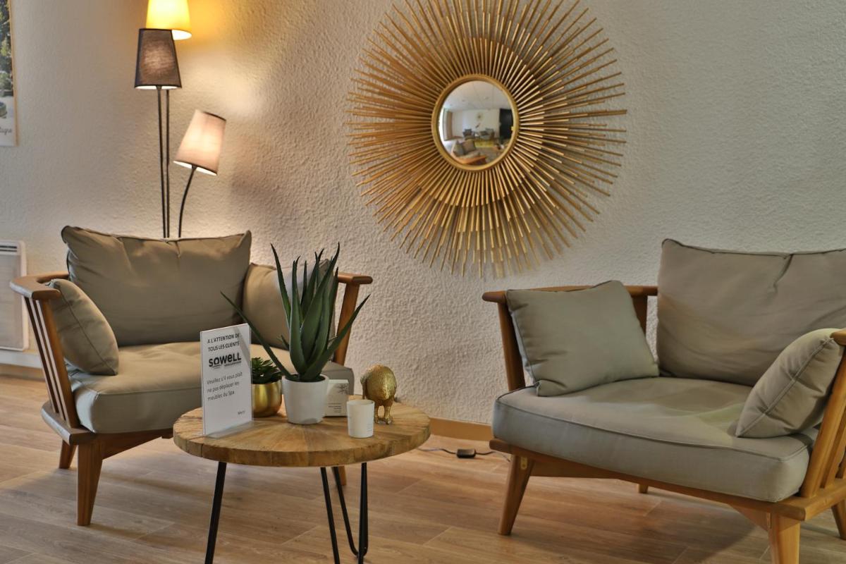 Coin salon dans l'établissement SOWELL HOTELS Mont Blanc et SPA