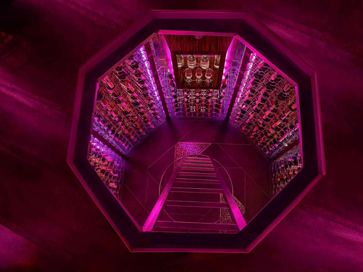 a purple stairwell with purple lights on it at Sofitel Mumbai BKC in Mumbai