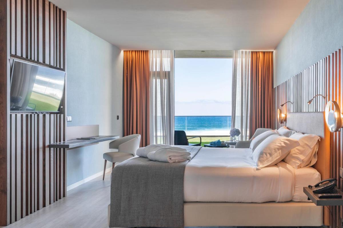 Uma cama ou camas num quarto em Hotel Verde Mar & SPA