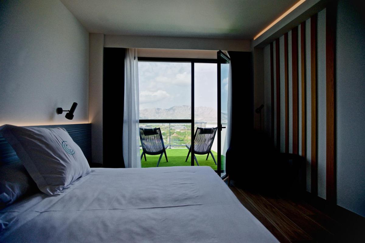 Cama o camas de una habitación en Syncrosfera Fitness & Spa Health Hotel Boutique