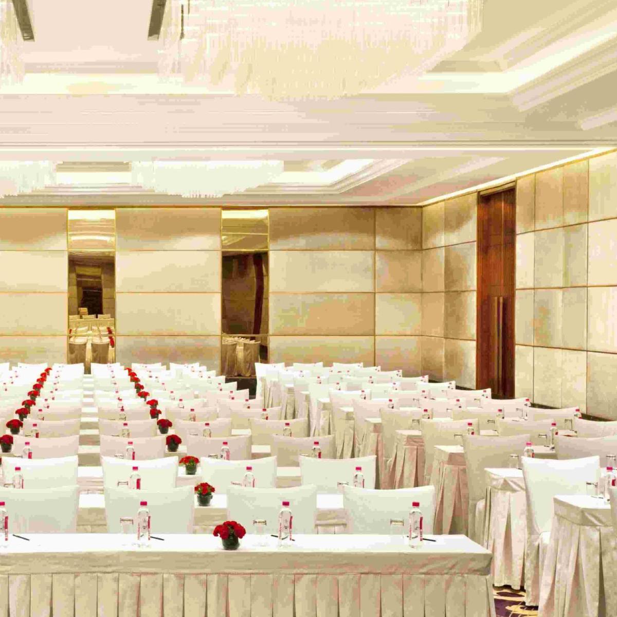 a large banquet hall with white tables and chairs at Holiday Inn New Delhi Mayur Vihar Noida by IHG in New Delhi a large banquet hall with white tables and chairs at Holiday Inn New Delhi Mayur Vihar Noida by IHG in New Delhi