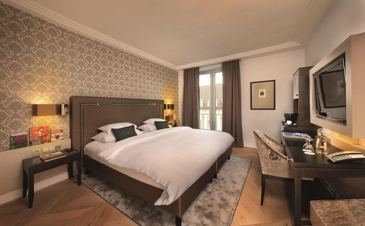 Ein Bett oder Betten in einem Zimmer der Unterkunft Hotel Maximilian’s