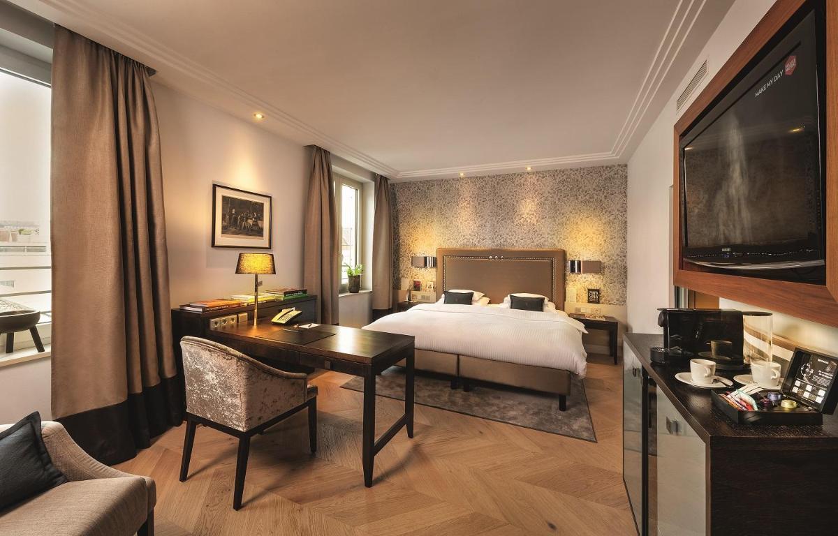 Ein Bett oder Betten in einem Zimmer der Unterkunft Hotel Maximilian’s