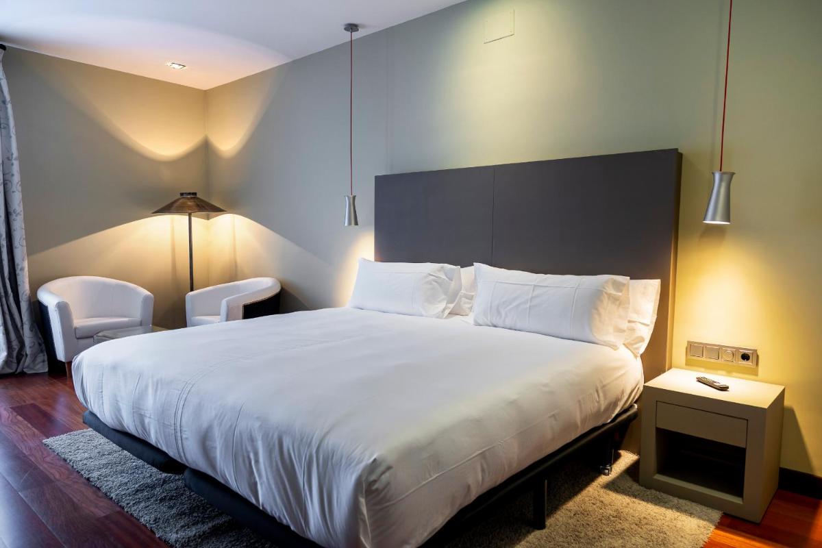Cama o camas de una habitación en Hotel AR Isabel de Farnesio