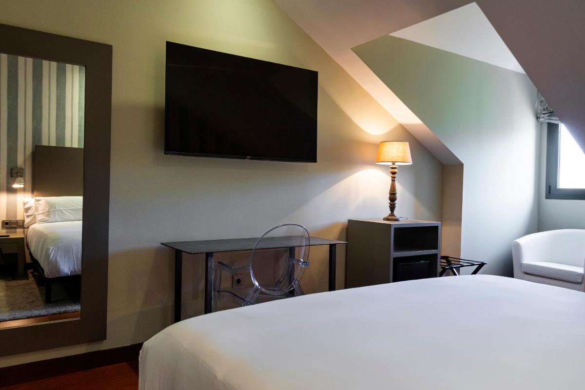 Cama o camas de una habitación en Hotel AR Isabel de Farnesio
