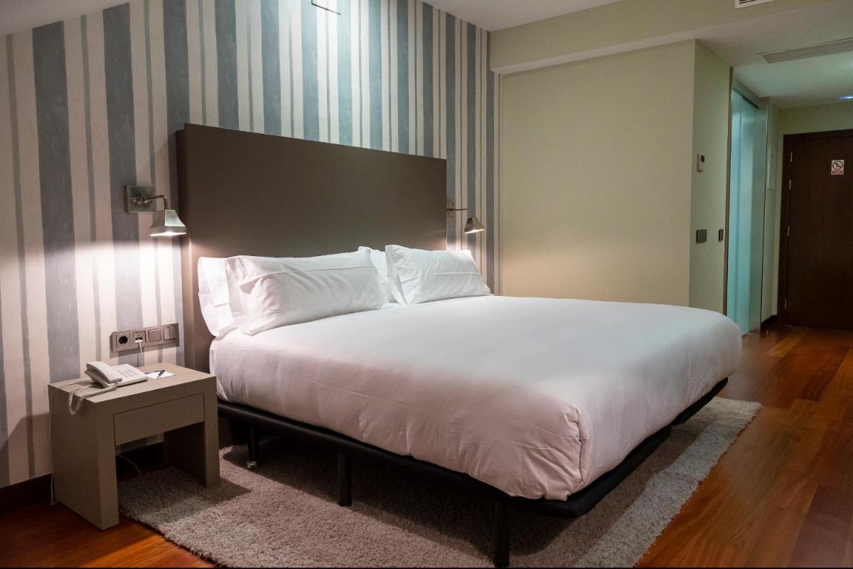 Cama o camas de una habitación en Hotel AR Isabel de Farnesio