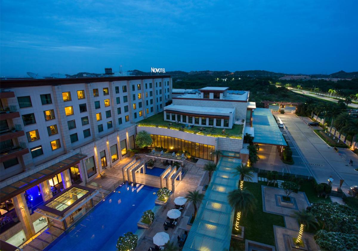 an overhead view of a hotel with a pool at Novotel Hyderabad Airport in Hyderabad
