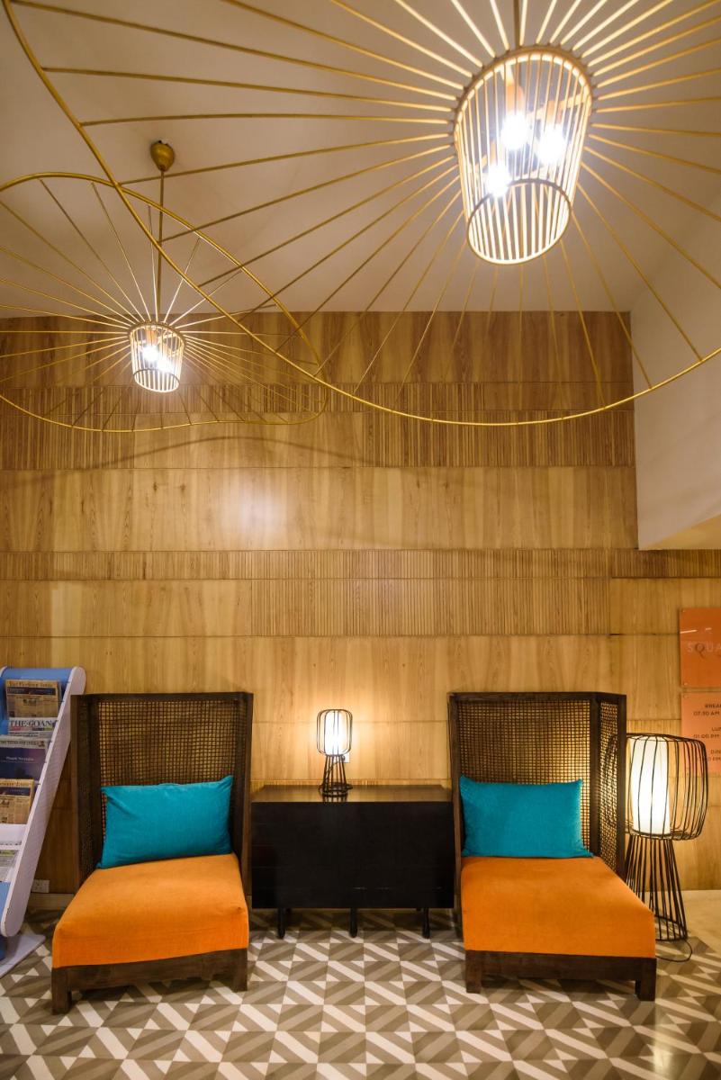 two beds in a room with two lights at Novotel Goa Candolim in Candolim two beds in a room with two lights at Novotel Goa Candolim in Candolim