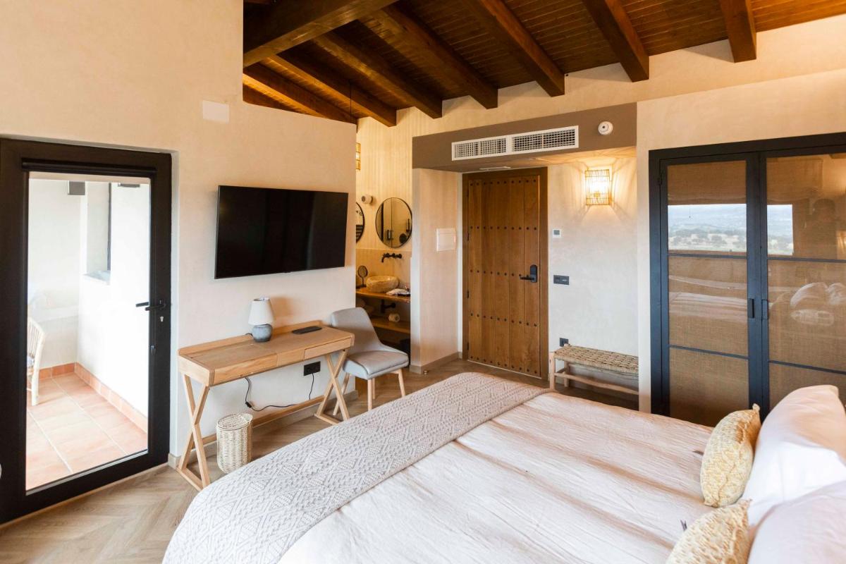 Cama o camas de una habitación en Hábitat Cigüeña Negra