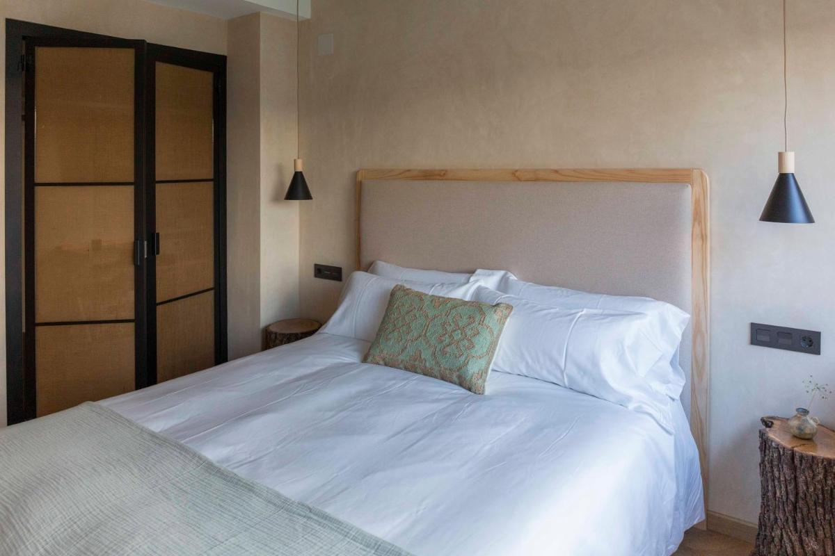 Cama o camas de una habitación en Hábitat Cigüeña Negra