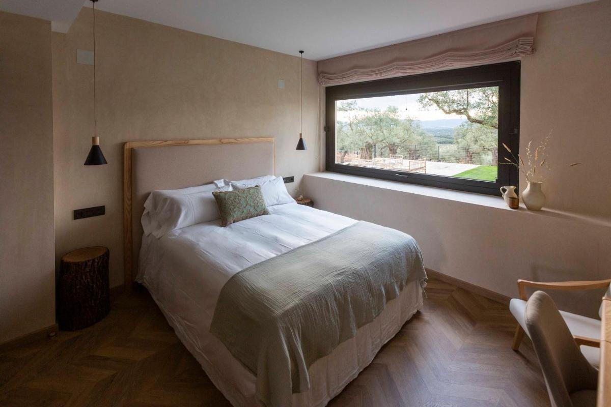 Cama o camas de una habitación en Hábitat Cigüeña Negra