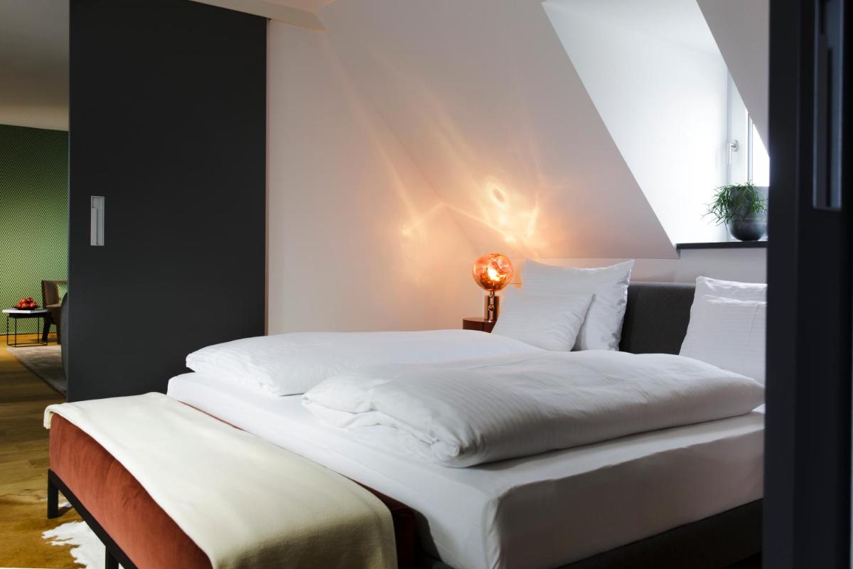 Ein Bett oder Betten in einem Zimmer der Unterkunft Hotel Maximilian’s