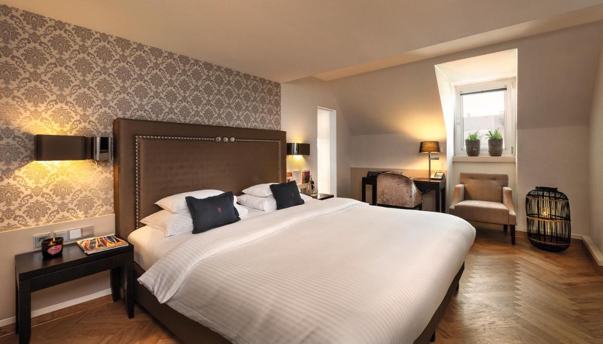 Ein Bett oder Betten in einem Zimmer der Unterkunft Hotel Maximilian’s