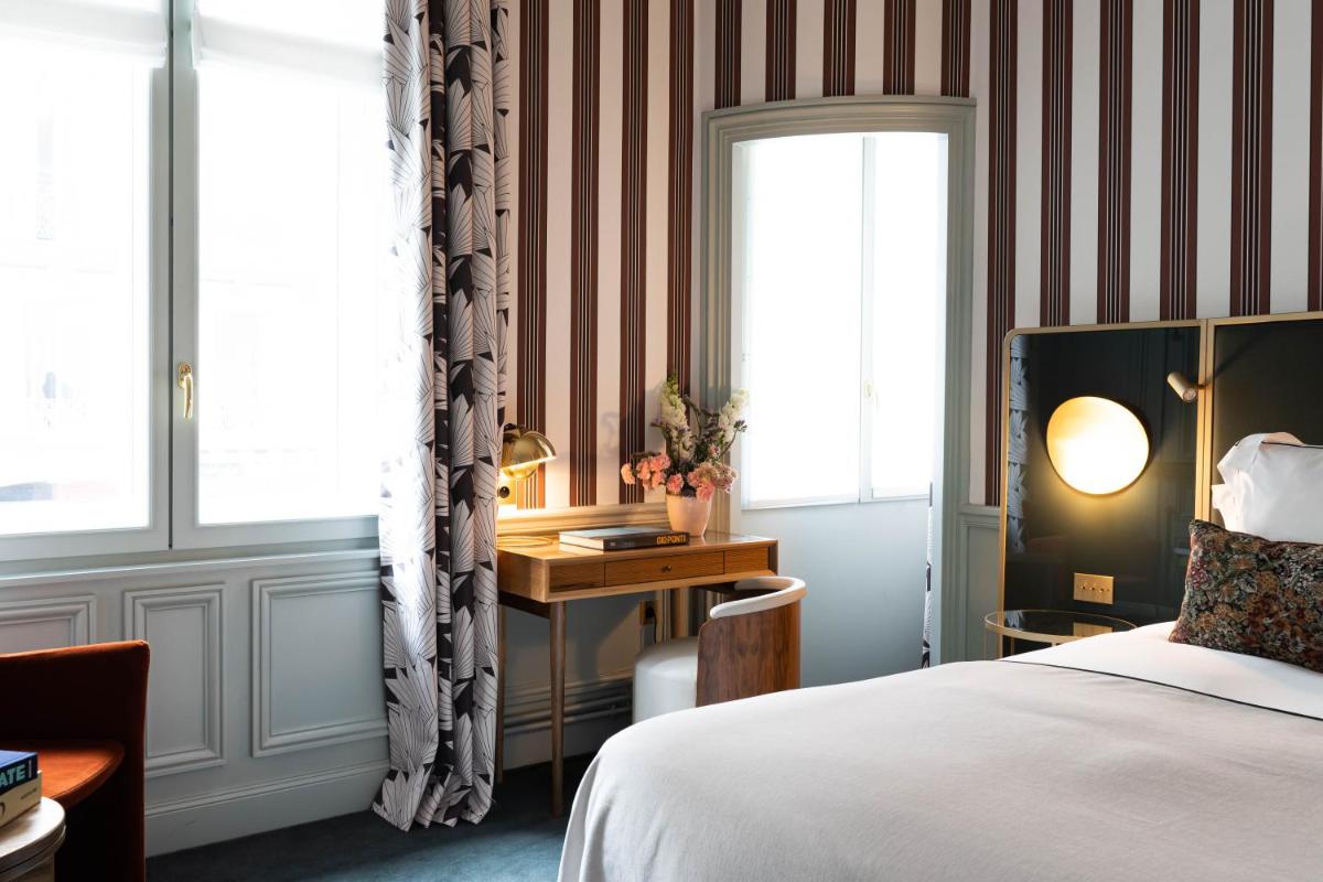 Un ou plusieurs lits dans un hébergement de l'établissement Grand Powers Hotel