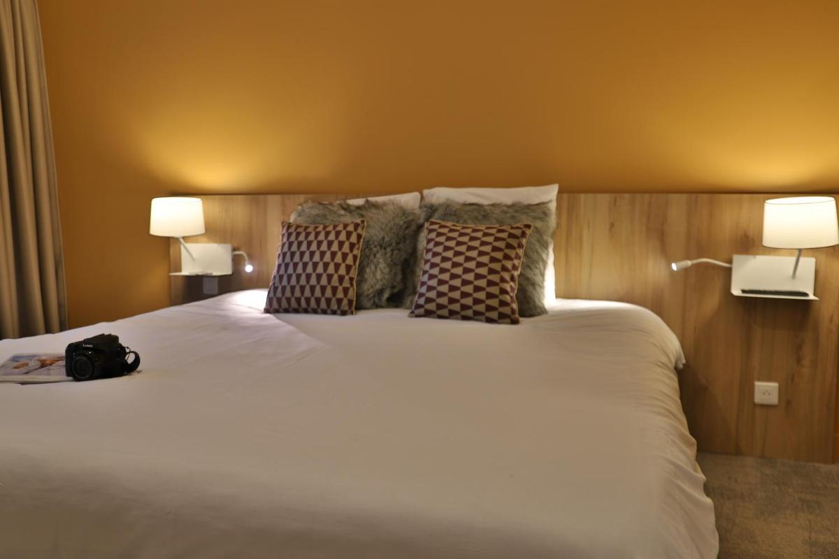 Un ou plusieurs lits dans un hébergement de l'établissement SOWELL HOTELS Mont Blanc et SPA