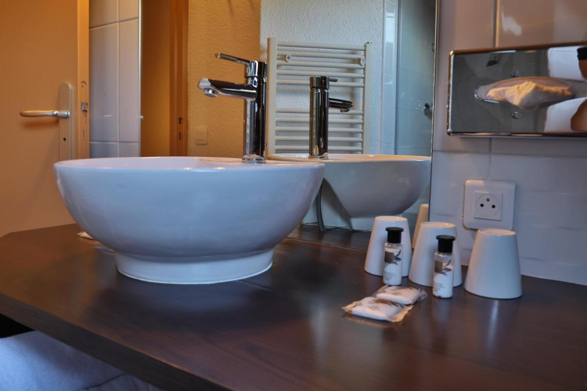 Salle de bains dans l'établissement SOWELL HOTELS Mont Blanc et SPA