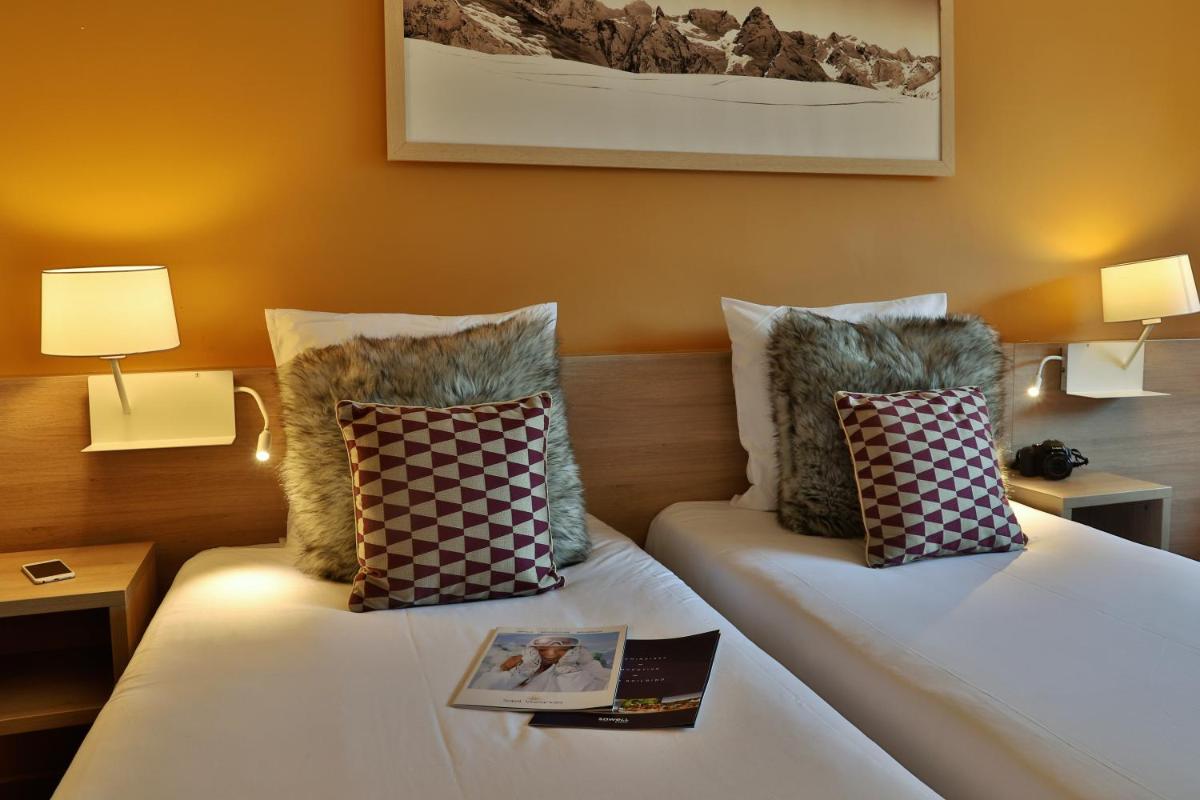 Un ou plusieurs lits dans un hébergement de l'établissement SOWELL HOTELS Mont Blanc et SPA