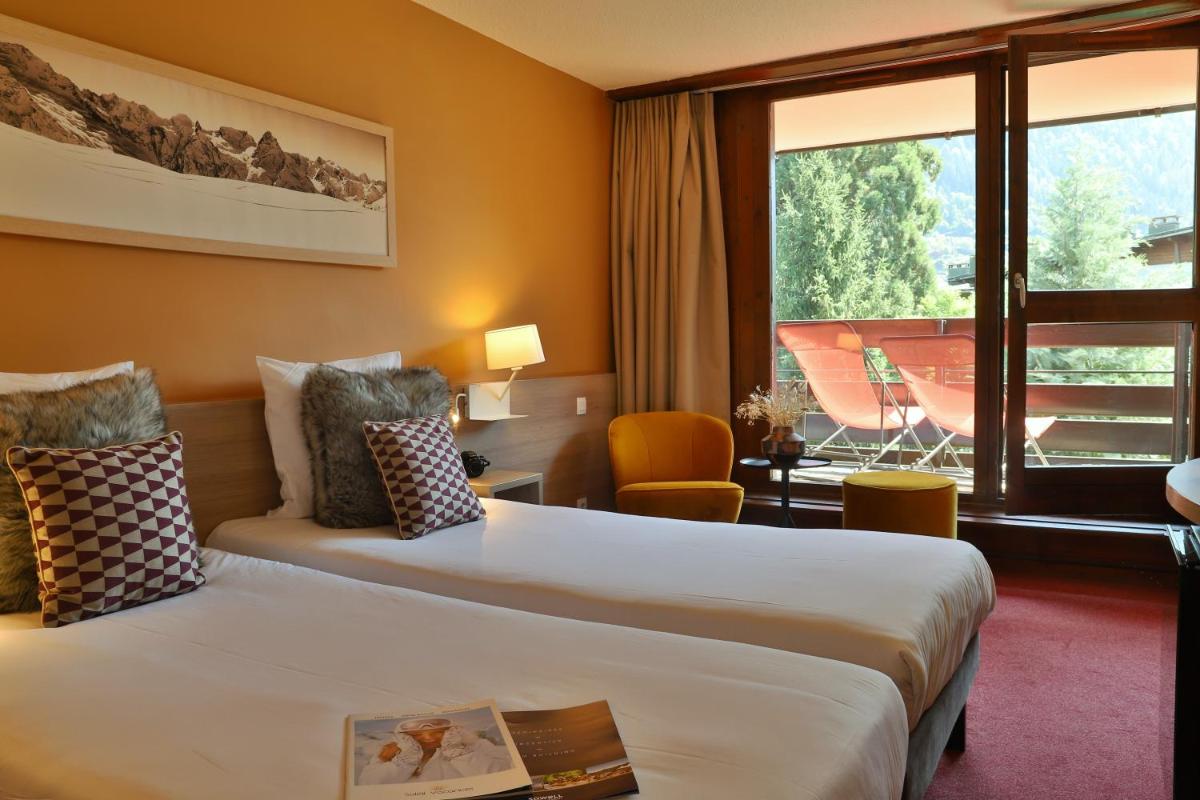 Un ou plusieurs lits dans un hébergement de l'établissement SOWELL HOTELS Mont Blanc et SPA