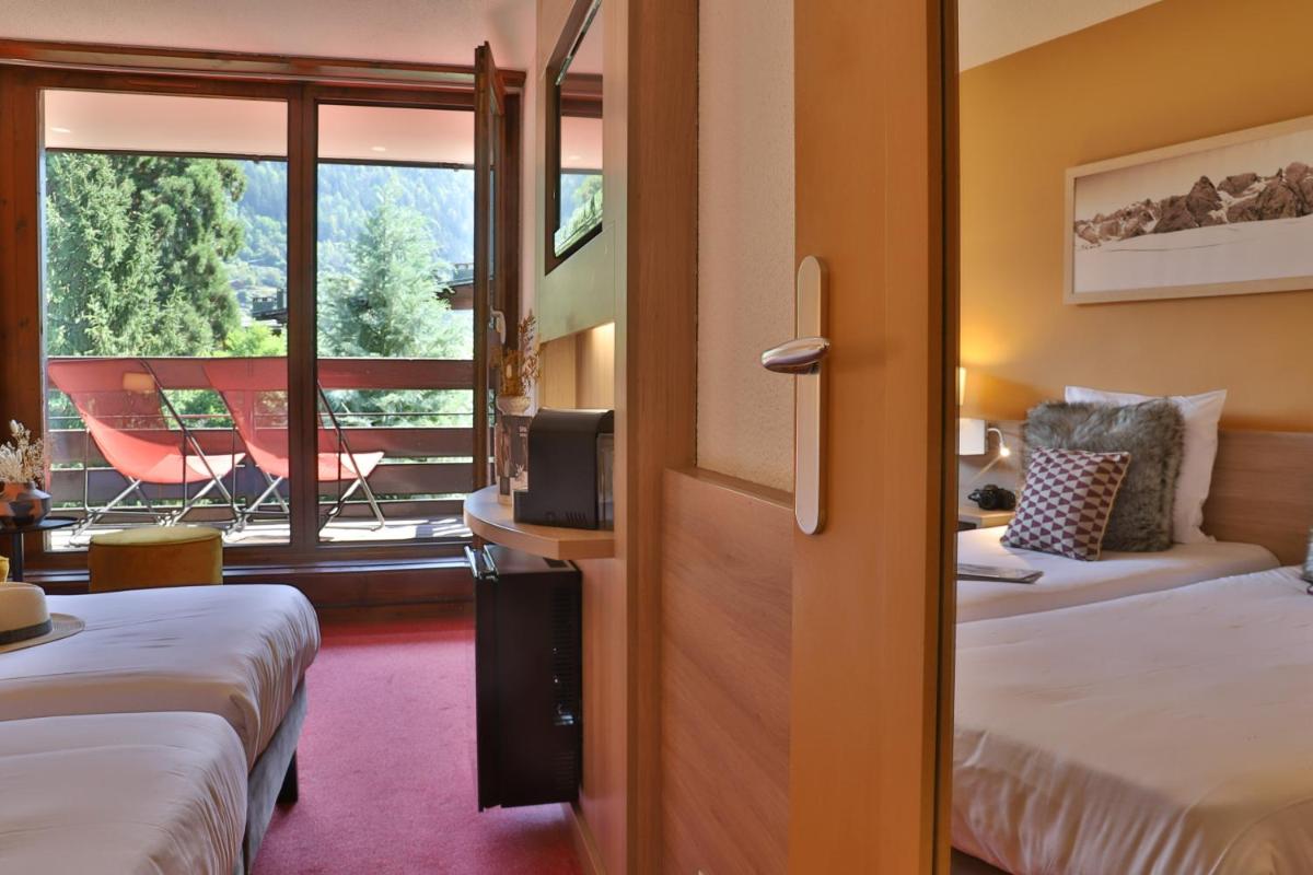 Un ou plusieurs lits dans un hébergement de l'établissement SOWELL HOTELS Mont Blanc et SPA