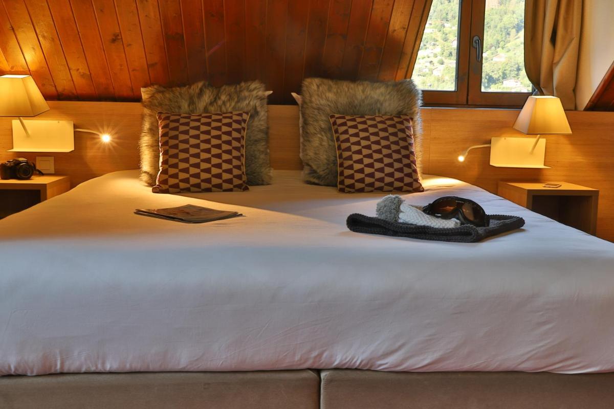 Un ou plusieurs lits dans un hébergement de l'établissement SOWELL HOTELS Mont Blanc et SPA