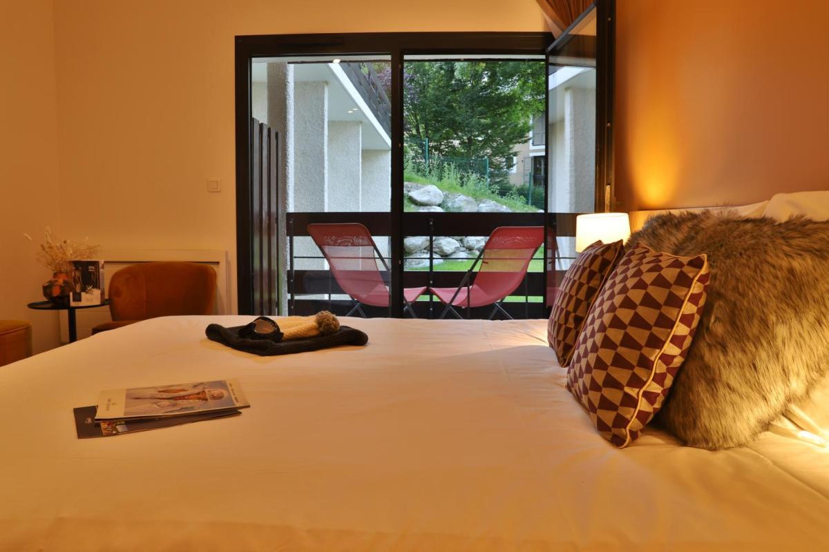 Un ou plusieurs lits dans un hébergement de l'établissement SOWELL HOTELS Mont Blanc et SPA