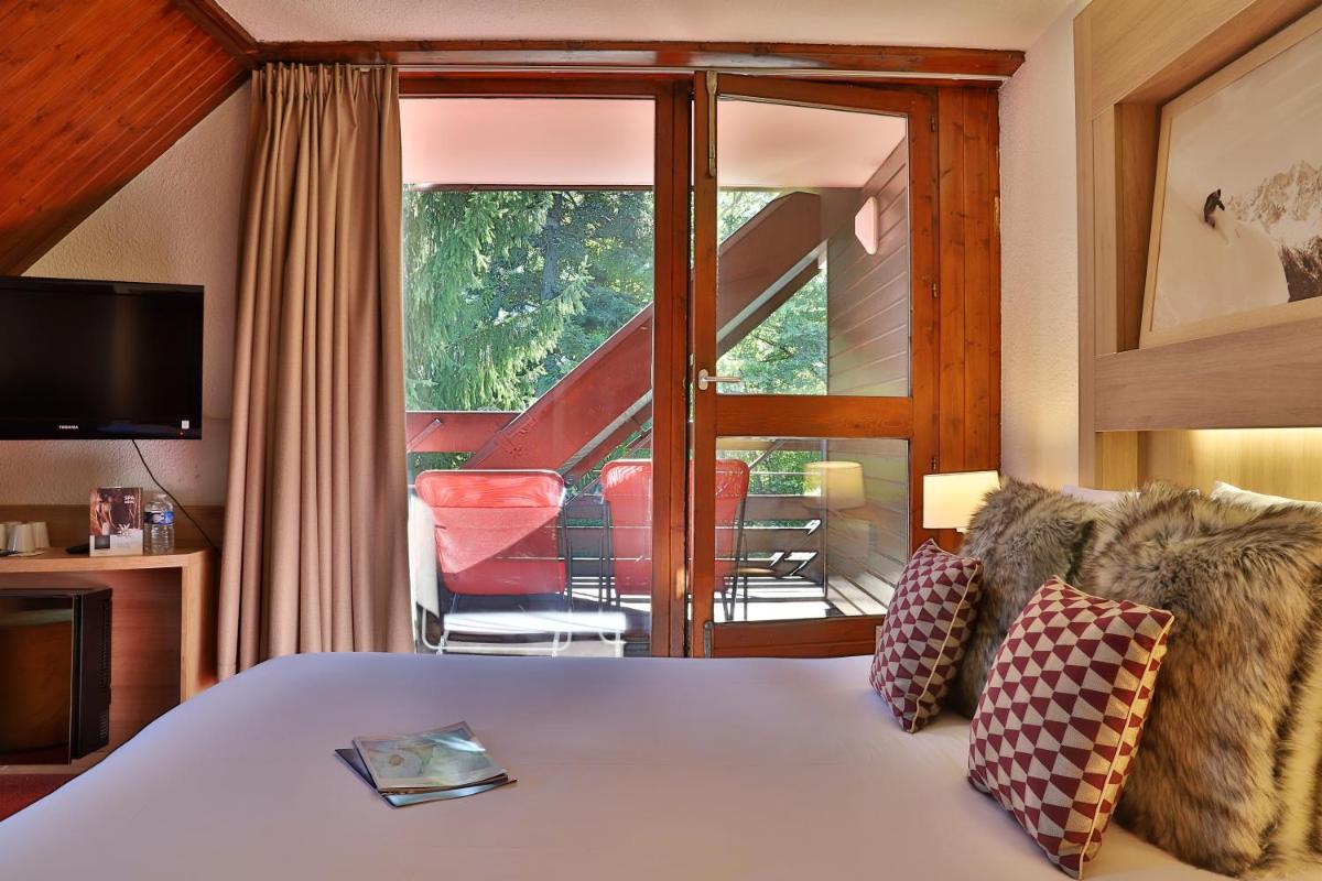 Un ou plusieurs lits dans un hébergement de l'établissement SOWELL HOTELS Mont Blanc et SPA