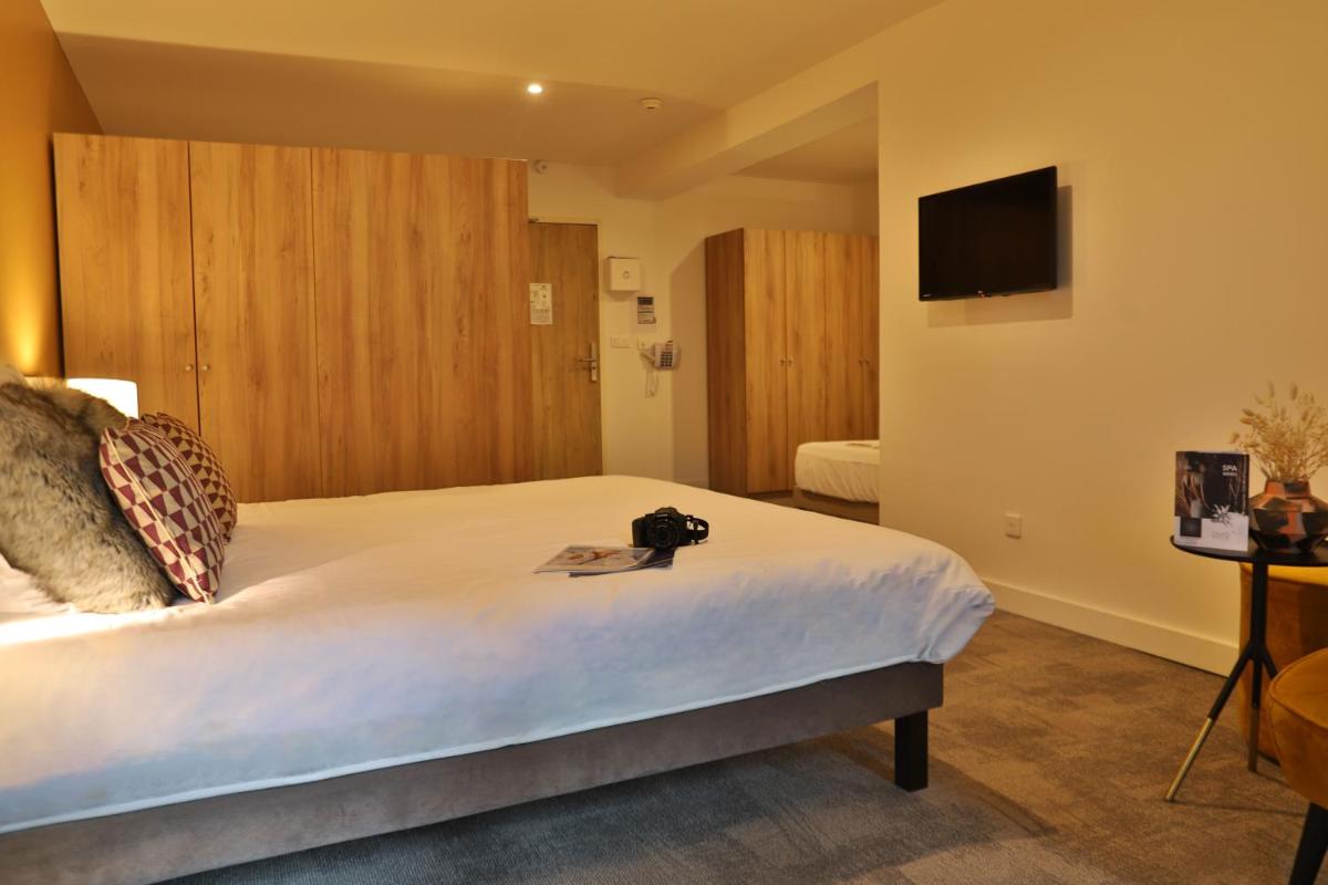 Un ou plusieurs lits dans un hébergement de l'établissement SOWELL HOTELS Mont Blanc et SPA