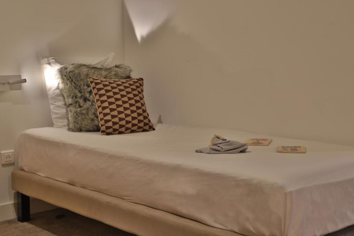 Un ou plusieurs lits dans un hébergement de l'établissement SOWELL HOTELS Mont Blanc et SPA