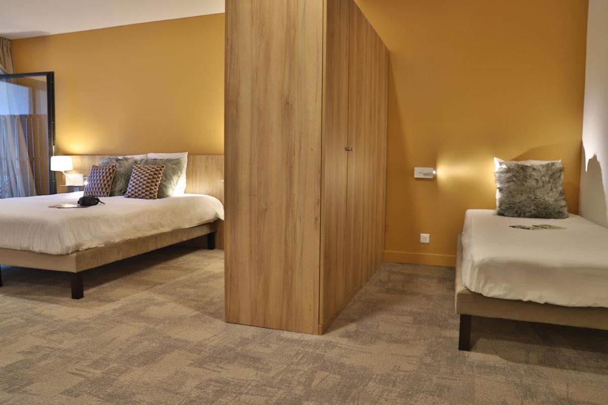 Un ou plusieurs lits dans un hébergement de l'établissement SOWELL HOTELS Mont Blanc et SPA