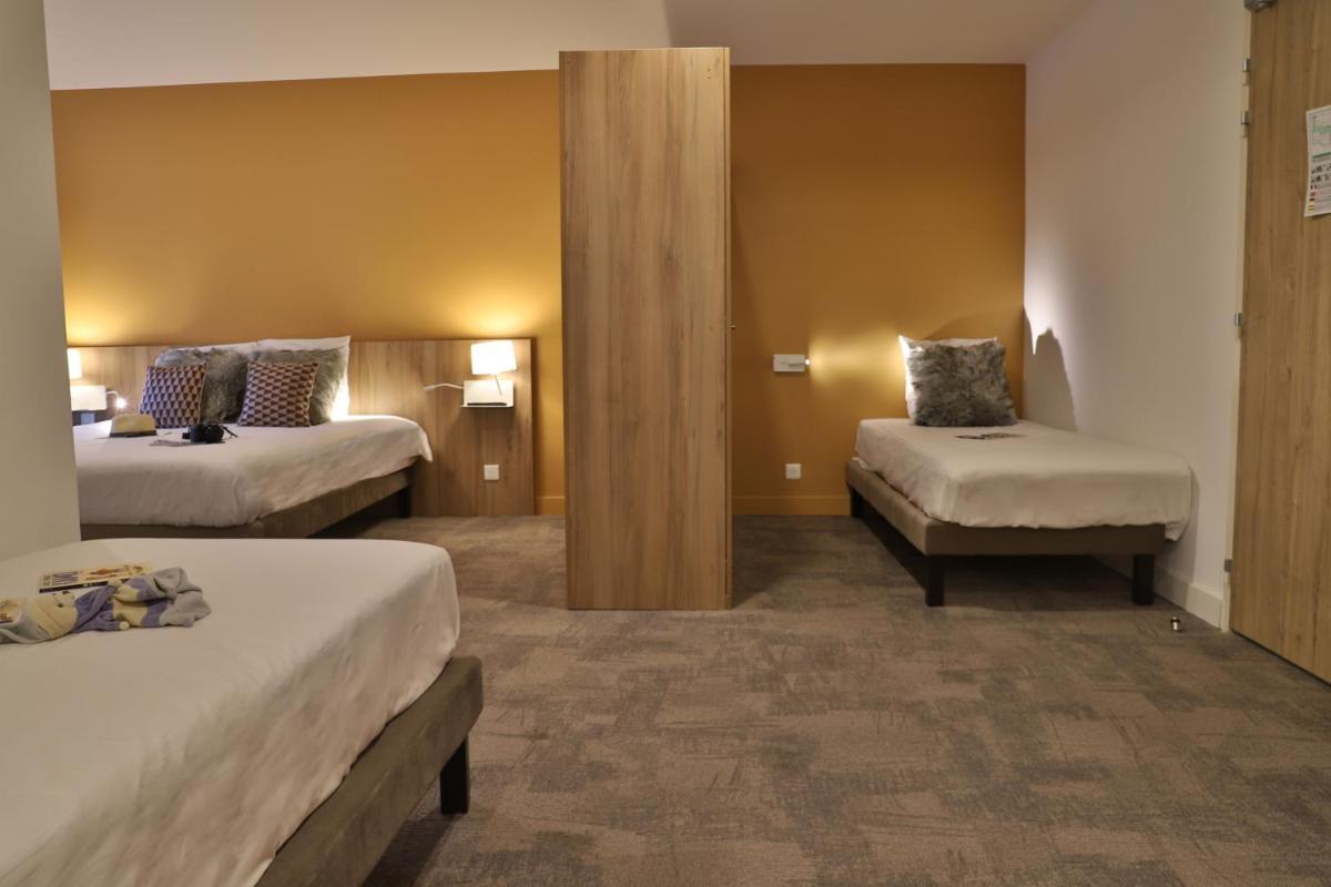 Un ou plusieurs lits dans un hébergement de l'établissement SOWELL HOTELS Mont Blanc et SPA