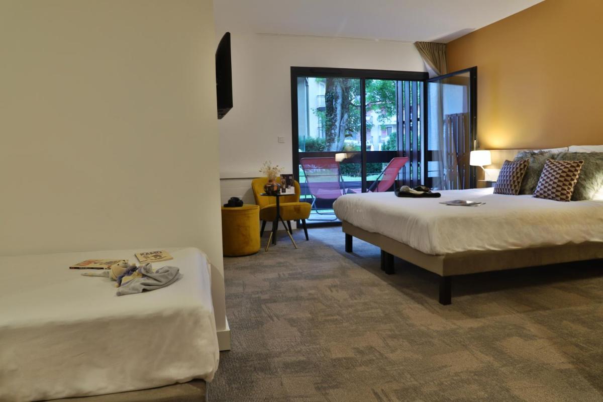 Un ou plusieurs lits dans un hébergement de l'établissement SOWELL HOTELS Mont Blanc et SPA